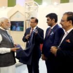 Recycled jacket being presented to PM Narendra Modi at Bharat Tex 2024 by (L-R) Bharat Tex chairman Narendra Goenka, co-chairman Bhadresh Dodhia, and secretary general Rakesh Kumar. Pic: Dodhia Group